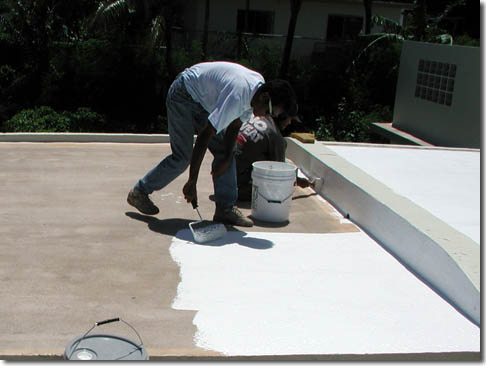 White roof coating being applied - photo courtesy of http://www.epdmcoatings.com/